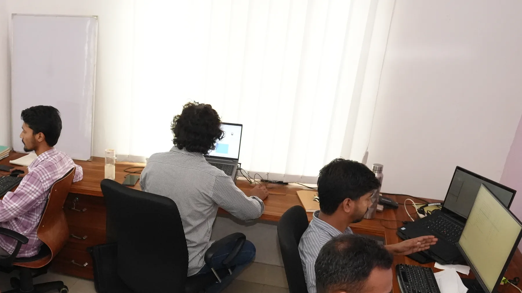 Zesterex engineers at work on the drafting floor in the Dhaka studio