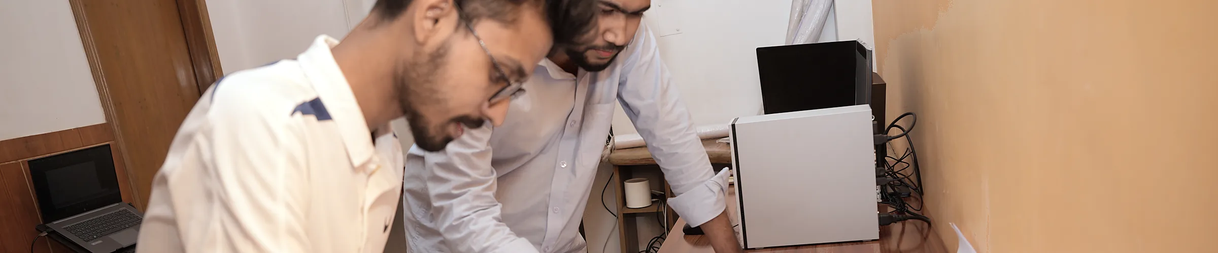 Two Zesterex engineers marking up a drawing set together