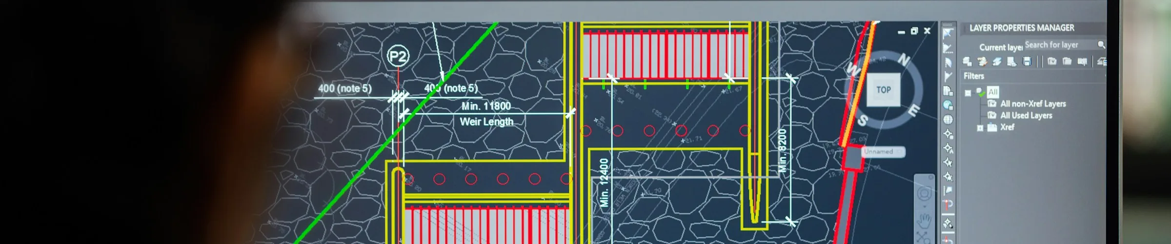 A CAD drawing open on an engineer’s monitor