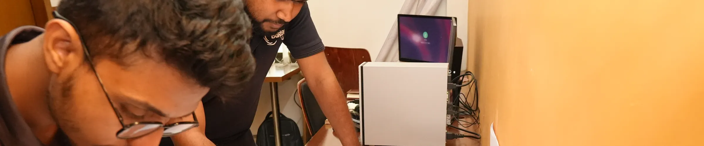 Two Zesterex engineers reviewing a printed drawing set together