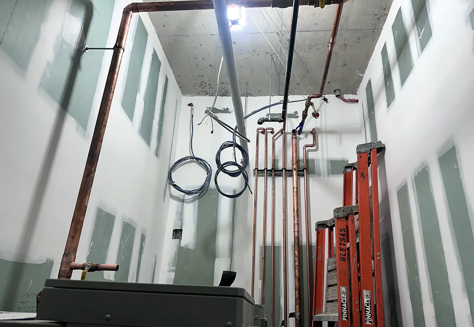Mechanical room with copper piping and equipment
