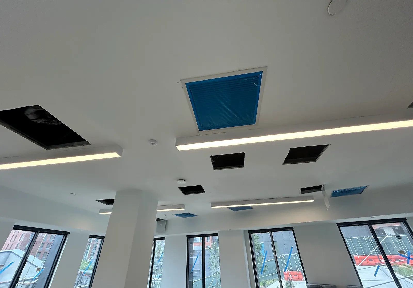 Open-plan space with linear ceiling lighting