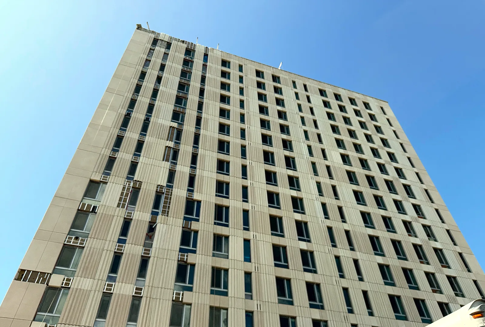 Facade of a multifamily tower seen from street level