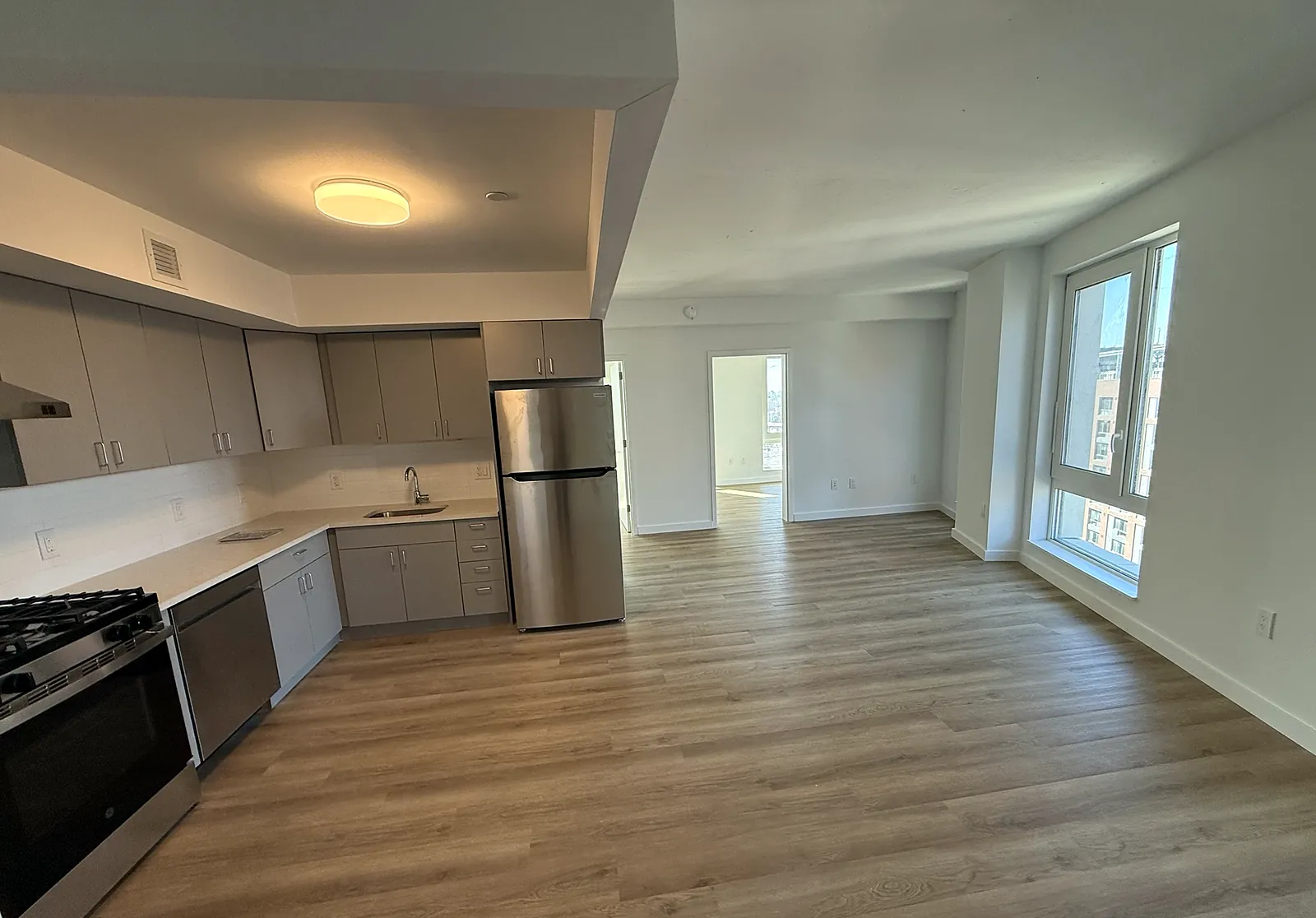 A finished apartment with kitchen and living area
